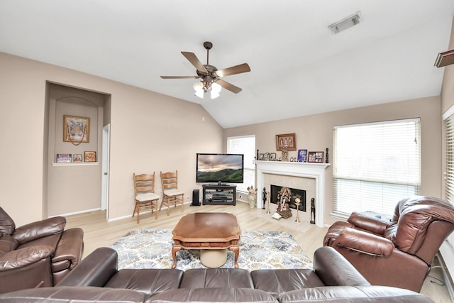 11843 Leaf Oak Dr, Houston, TX 77065 - living area with ceiling fan, lofted ceiling, a fireplace, wood finished floors, and baseboards