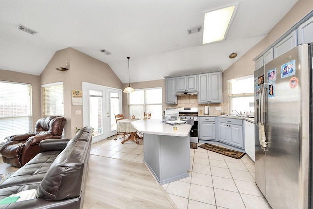 11843 Leaf Oak Dr, Houston, TX 77065 - kitchen with appliances with stainless steel finishes, open floor plan, gray cabinets, a sink, and lofted ceiling