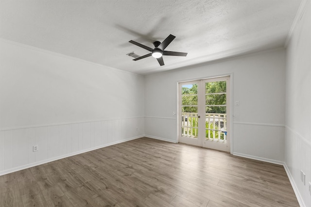 563 Roanoke Dr, Conroe, TX 77302 - unfurnished room with a ceiling fan, wood finished floors, a textured ceiling, and crown molding
