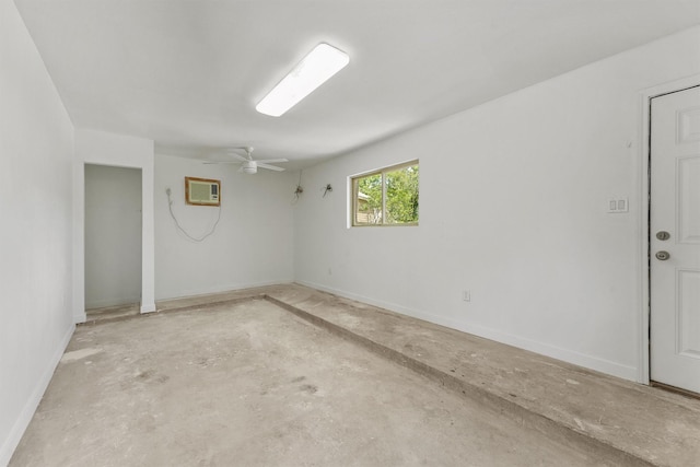 563 Roanoke Dr, Conroe, TX 77302 - spare room with concrete flooring, ceiling fan, baseboards, and an AC wall unit