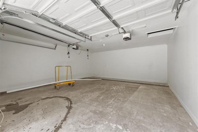 563 Roanoke Dr, Conroe, TX 77302 - garage with a garage door opener and baseboards