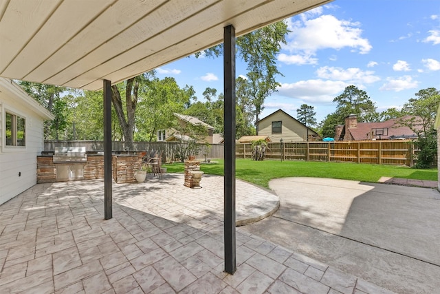 563 Roanoke Dr, Conroe, TX 77302 - view of patio with exterior kitchen and area for grilling