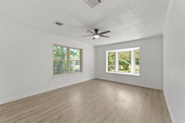 563 Roanoke Dr, Conroe, TX 77302 - unfurnished room featuring a ceiling fan, a textured ceiling, baseboards, and light wood finished floors