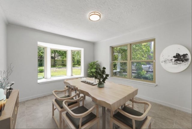 563 Roanoke Dr, Conroe, TX 77302 - dining area with a textured ceiling and baseboards