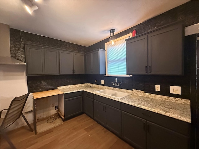 544 W 28th St, Houston, TX 77008 - kitchen with a sink, light wood-type flooring, wall chimney range hood, and backsplash