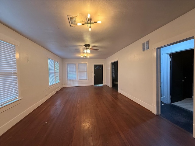 544 W 28th St, Houston, TX 77008 - spare room featuring dark wood-style floors, baseboards, and a ceiling fan