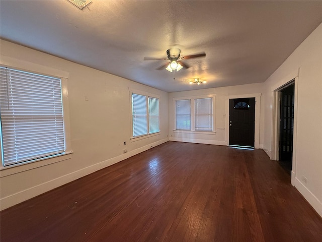 544 W 28th St, Houston, TX 77008 - unfurnished living room with wood finished floors, baseboards, and a ceiling fan