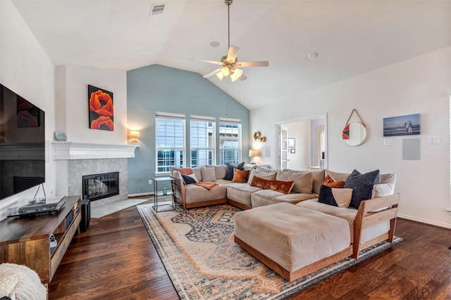 2101 Menard Ave, Seabrook, TX 77586 - living room with a high end fireplace, a ceiling fan, lofted ceiling, dark wood finished floors, and baseboards