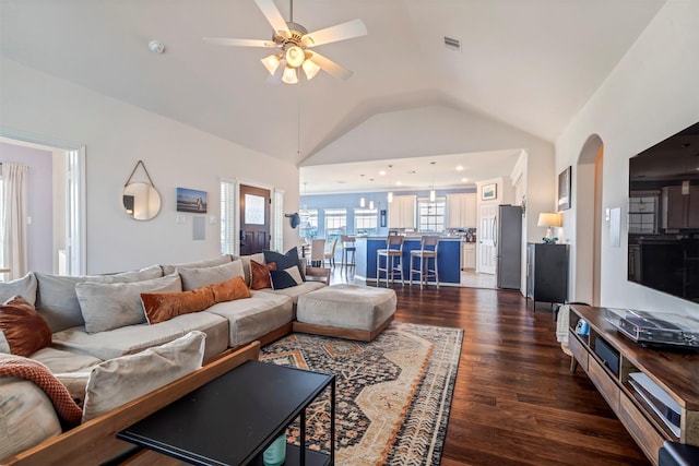 2101 Menard Ave, Seabrook, TX 77586 - living room with dark wood finished floors, vaulted ceiling, and ceiling fan
