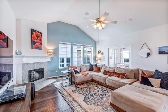 2101 Menard Ave, Seabrook, TX 77586 - living area with a high end fireplace, ceiling fan, vaulted ceiling, wood finished floors, and plenty of natural light