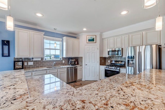 2101 Menard Ave, Seabrook, TX 77586 - kitchen featuring appliances with stainless steel finishes, a sink, light stone countertops, crown molding, and backsplash