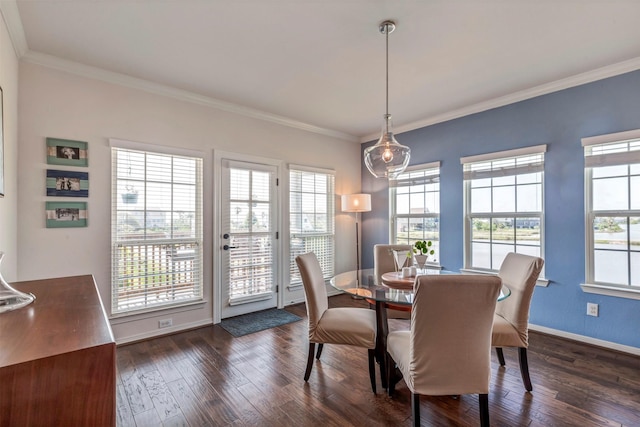2101 Menard Ave, Seabrook, TX 77586 - dining area featuring dark wood-style flooring, ornamental molding, and baseboards