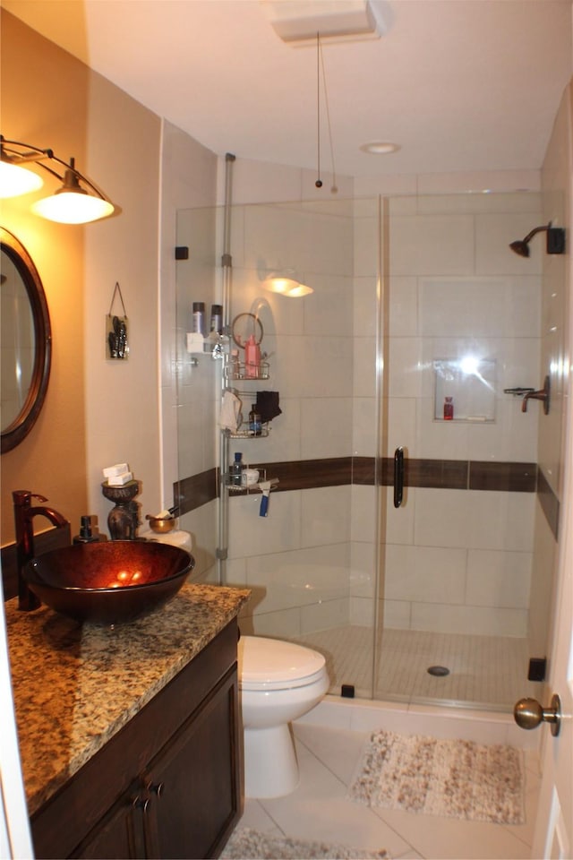 2619 Sailboat Dr, Houston, TX 77058 - bathroom with a stall shower, vanity, toilet, and tile patterned floors