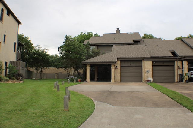 2619 Sailboat Dr, Houston, TX 77058 - view of front facade featuring a front lawn, brick siding, a shingled roof, driveway, and a chimney
