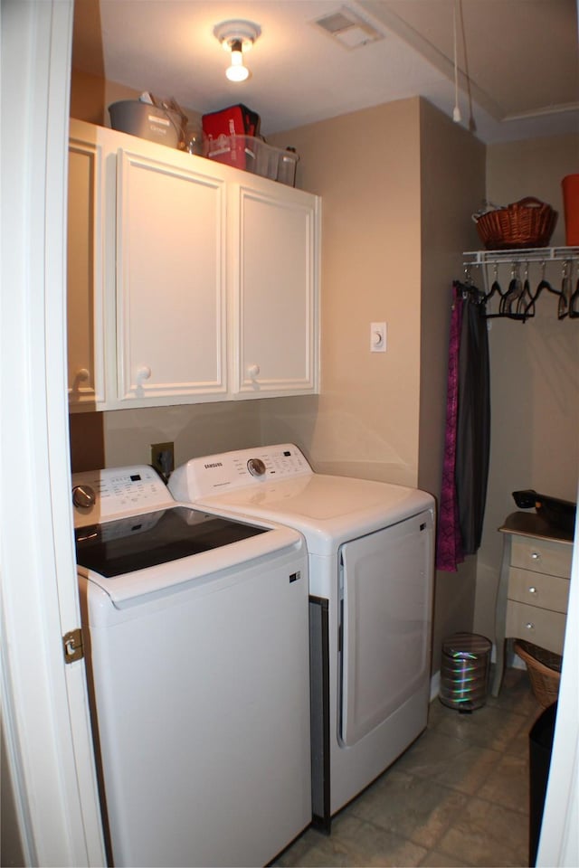 2619 Sailboat Dr, Houston, TX 77058 - laundry room featuring cabinet space and separate washer and dryer