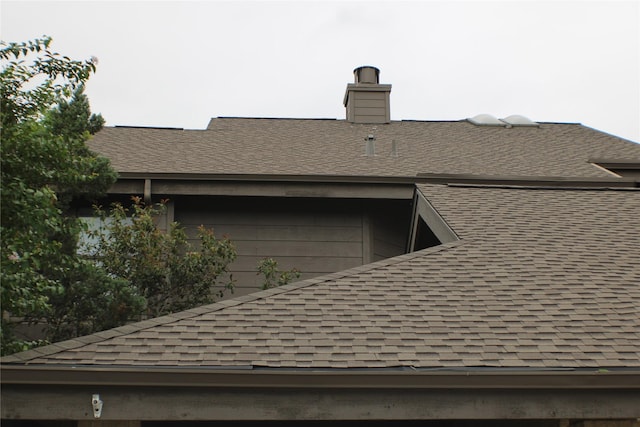 2619 Sailboat Dr, Houston, TX 77058 - exterior view of roof with shingles and a chimney