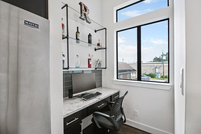 2205 Colorado St, Houston, TX 77007 - office area with dark wood finished floors, baseboards, and built in desk