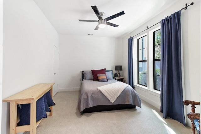 2205 Colorado St, Houston, TX 77007 - carpeted bedroom with baseboards and ceiling fan