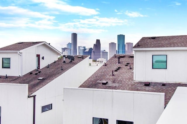 2205 Colorado St, Houston, TX 77007 - view of side of home featuring roof with shingles