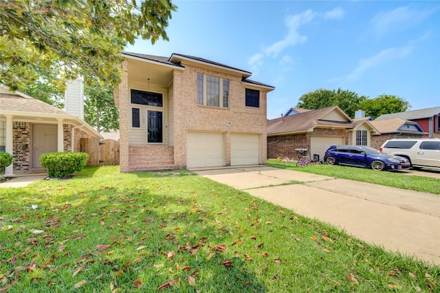 view of front facade with brick siding, an attached garage, a front yard, and driveway