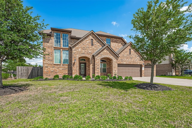 29046 Endeavor River Rd, Katy, TX 77494 - traditional-style house with concrete driveway, brick siding, an attached garage, and roof with shingles