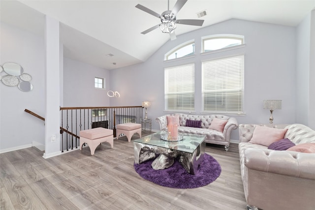 29122 Artic Brook Ln, Fulshear, TX 77441 - living room with wood finished floors, ceiling fan, vaulted ceiling, and baseboards