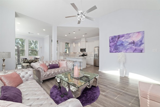 29122 Artic Brook Ln, Fulshear, TX 77441 - living area featuring light wood-style flooring, ceiling fan, crown molding, recessed lighting, and vaulted ceiling