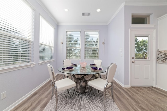 29122 Artic Brook Ln, Fulshear, TX 77441 - dining room with light wood finished floors, ornamental molding, baseboards, and recessed lighting