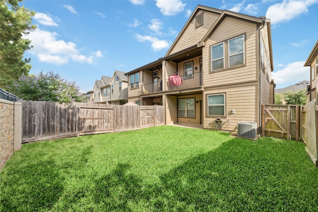 29122 Artic Brook Ln, Fulshear, TX 77441 - back of house featuring a balcony, cooling unit, and a gate