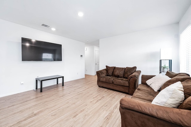 9927 Archdale Spring Dr, Baytown, TX 77521 - living room featuring light wood-style floors and recessed lighting