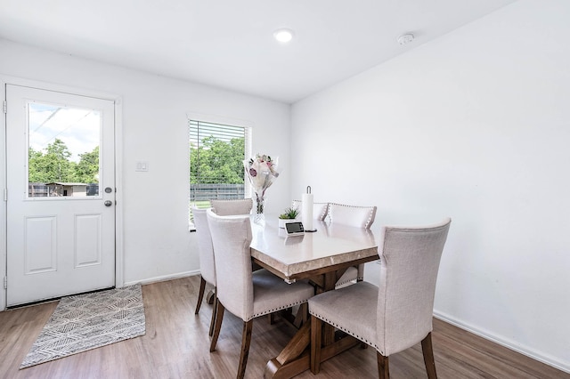 9927 Archdale Spring Dr, Baytown, TX 77521 - dining room with wood finished floors and baseboards