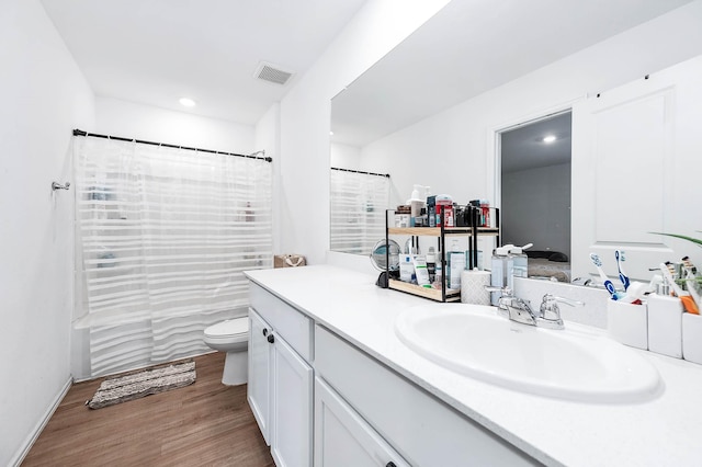 9927 Archdale Spring Dr, Baytown, TX 77521 - bathroom with vanity, wood finished floors, toilet, and a shower with shower curtain