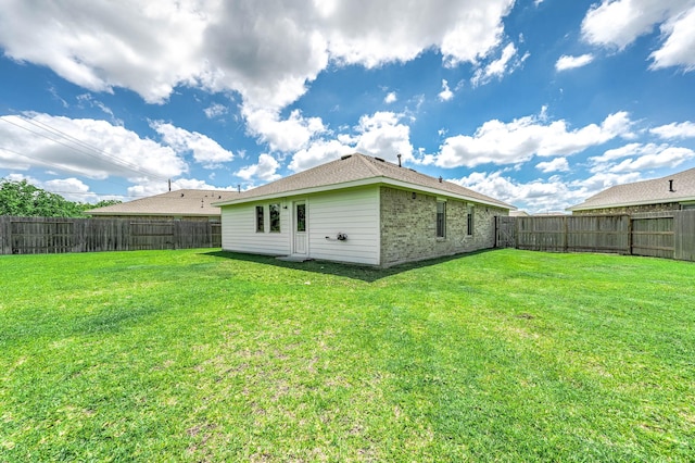 9927 Archdale Spring Dr, Baytown, TX 77521 - rear view of property with brick siding