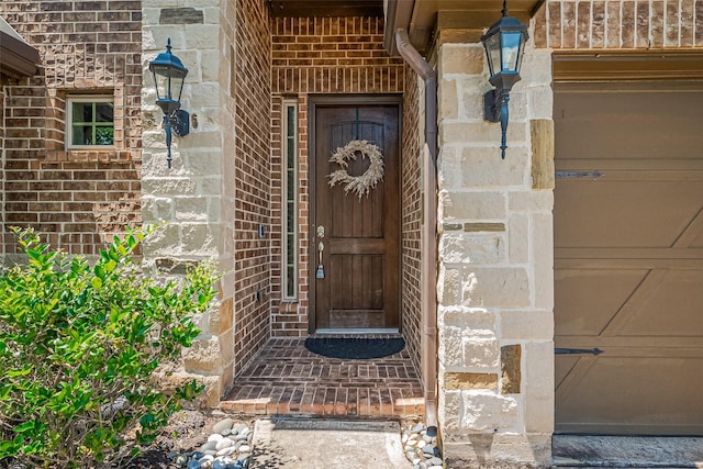 property entrance featuring brick siding