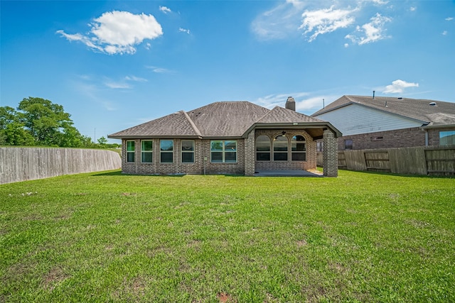 back of house featuring a patio area, brick siding, and a ceiling fan