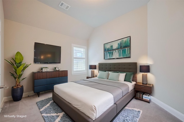 bedroom with light carpet, baseboards, and vaulted ceiling