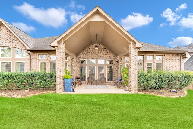 222 Reynosa Ct, Pinehurst, TX 77362 - back of property featuring brick siding, a lawn, a patio, and a shingled roof
