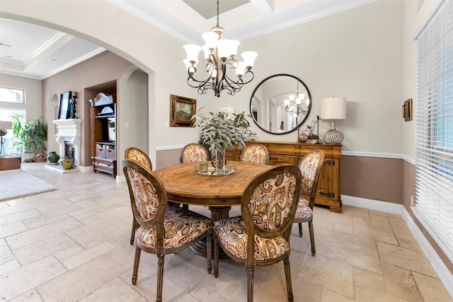 222 Reynosa Ct, Pinehurst, TX 77362 - dining space featuring stone tile flooring, ornamental molding, arched walkways, a chandelier, and a raised ceiling