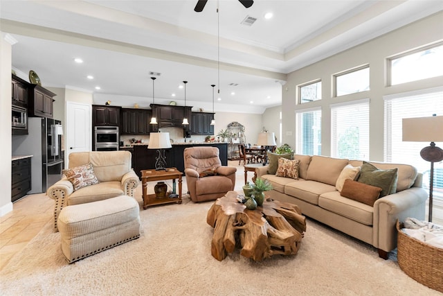 222 Reynosa Ct, Pinehurst, TX 77362 - living room with recessed lighting, ornamental molding, and ceiling fan