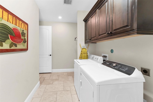 222 Reynosa Ct, Pinehurst, TX 77362 - laundry area featuring cabinet space, stone tile floors, baseboards, recessed lighting, and washer and dryer