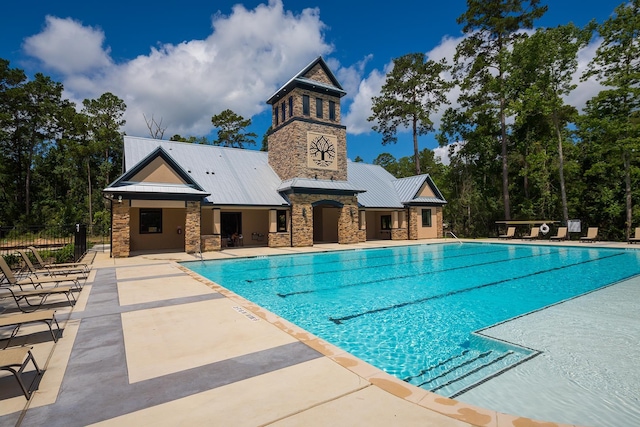 222 Reynosa Ct, Pinehurst, TX 77362 - community pool with fence and a patio