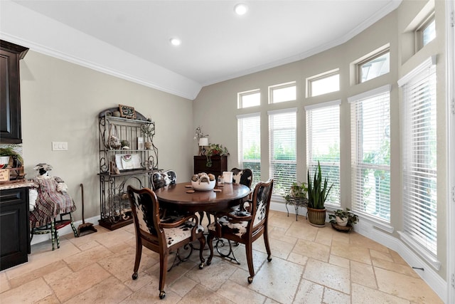 222 Reynosa Ct, Pinehurst, TX 77362 - dining space featuring stone tile floors, ornamental molding, recessed lighting, and baseboards