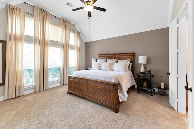 222 Reynosa Ct, Pinehurst, TX 77362 - bedroom featuring vaulted ceiling, light colored carpet, multiple windows, ceiling fan, and crown molding