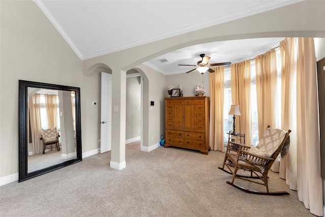 222 Reynosa Ct, Pinehurst, TX 77362 - sitting room with arched walkways, healthy amount of natural light, ceiling fan, light colored carpet, and crown molding