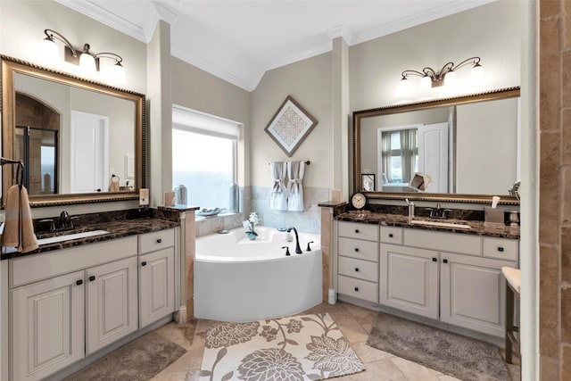 222 Reynosa Ct, Pinehurst, TX 77362 - bathroom with crown molding, a bath, and two vanities
