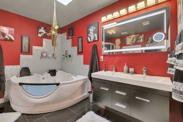 6206 Bayou Blvd, Baytown, TX 77521 - bathroom featuring a tub with jets and double vanity