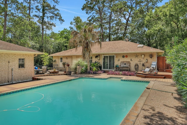 6206 Bayou Blvd, Baytown, TX 77521 - outdoor pool with fence and a wooden deck
