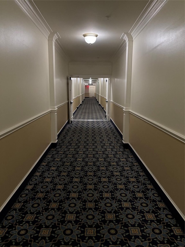 2111 Welch St Unit A307, Houston, TX 77019 - hall featuring dark carpet, crown molding, and baseboards