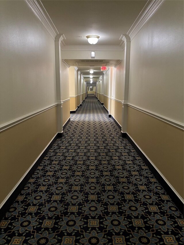 2111 Welch St Unit A307, Houston, TX 77019 - hallway featuring crown molding, dark colored carpet, and baseboards