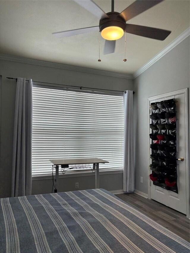 2111 Welch St Unit A307, Houston, TX 77019 - bedroom with baseboards, wood finished floors, a ceiling fan, and ornamental molding